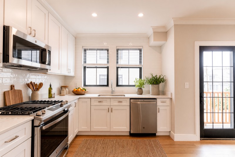 Kitchen with quartz counters and gas range at 285 Lamartine Street Unit 2